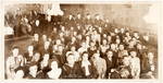 LARGE GROUP PHOTO OF AFRICAN AMERICAN NAVY MEN AND THEIR DATES AT A "SHIP DANCE."