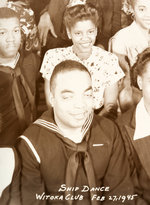 LARGE GROUP PHOTO OF AFRICAN AMERICAN NAVY MEN AND THEIR DATES AT A "SHIP DANCE."