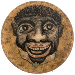 VERY EARLY CARTOON CARICATURE BUTTON PICTURING A BLACK MAN FROM HAKE COLOR PLATES.