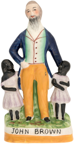 "JOHN BROWN" GLAZED CERAMIC FIGURE DEPICTING THE ABOLITIONIST MARTYR WITH TWO SLAVE CHILDREN.