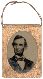 LINCOLN C. 1865 CAMPAIGN TINTYPE WITH THIN CORD FOR SUSPENSION.