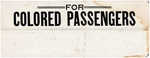 RARE JIM CROW ERA "FOR COLORED PASSENGERS" CARDBOARD TROLLEY SIGN.