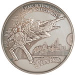 SUPERMAN 50th ANNIVERSARY SILVER POUND MEDALLION IN PRESENTATION CASE.