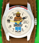 "SMOKEY BEAR" BRADLEY WATCH IN PLASTIC CASE.