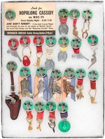 HOPALONG CASSIDY FOUR DIFFERENT BUTTON DESIGNS WITH 22 HANGER VARIATIONS.