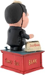 "REAGANOMICS" CAST IRON MECHANICAL BANK.