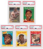 HANK AARON 1950s TOPPS PSA GRADED LOT OF SEVEN CARDS.