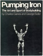 ARNOLD SCHWARZENEGGER SIGNED "PUMPING IRON" BOOK .