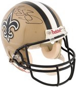 DREW BREES & REGGIE BUSH SIGNED NEW ORLEANS SAINTS FOOTBALL HELMETS.