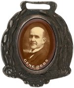 OVAL "GENE DEBS" SEPIA TONED REAL PHOTO CELLO SET IN LOVELY METAL WATCH FOB.