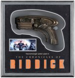 CHRONICLES OF RIDDICK PROP PISTOL WEAPON IN DISPLAY CASE.