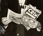 CRIME SCENE PHOTO WITH COMIC BOOKS.