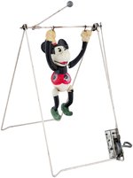 MINNIE MOUSE CELLULOID TRAPEZE WIND-UP TOY.