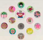 PETER MAX SEVEN BUTTONS INCLUDING SCARCE PORTRAIT PLUS SEVEN BUTTON-LIKE SEGMENTS TO FORM A BELT.