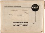 NASA ASTRONAUTS SIGNED PHOTO LOT WITH NASA ENVELOPE.