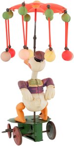 "DONALD DUCK CAROUSEL" BOXED CELLULOID WIND-UP TOY.