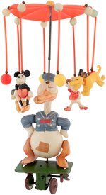 "DONALD DUCK CAROUSEL" WIND-UP CELLULOID TOY.