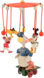 "DONALD DUCK CAROUSEL" WIND-UP CELLULOID TOY.