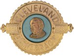 "CLEVELAND DEMOCRACY" LARGE BRASS AND CLOTH BADGE.