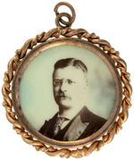 THEODORE ROOSEVELT 1904 FOUR SIMILARLY TINTED PINS, PENDANTS & STICKPIN.