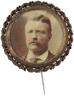 THEODORE ROOSEVELT 1904 FOUR SIMILARLY TINTED PINS, PENDANTS & STICKPIN.