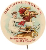 "INTERNATIONAL SHIRT & COLLAR" AD BUTTON WITH BLINDFOLDED SHRINER INITIATE RIDING A CAMEL.
