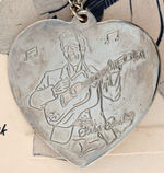 "ELVIS PRESLEY LOVE ME TENDER NECKLACE" ON DISPLAY CARD.