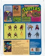 "TEENAGE MUTANT NINJA TURTLES - SHREDDER" SERIES 1 10 BACK AFA 85 NM+ (POP-UP DISPLAY).