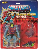 "MASTERS OF THE UNIVERSE - DRAGON BLASTER SKELETOR" SERIES 4 ACTION FIGURE ON 12-BACK CARD.