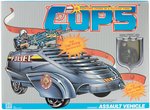 C.O.P.S. 'N CROOKS LOT OF EIGHT CARDED ACTION FIGURES AND BOXED ASSAULT VEHICLE.