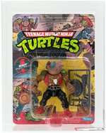 "TEENAGE MUTANT NINJA TURTLES - BEBOP" SERIES 1 10 BACK AFA 85 Y-NM+.