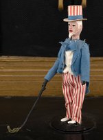 WORLD WAR II OUTSTANDING ANTI-AXIS FOLK ART AUTOMATON WITH UNCLE SAM.