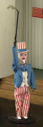 WORLD WAR II OUTSTANDING ANTI-AXIS FOLK ART AUTOMATON WITH UNCLE SAM.