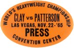 MUHAMMAD ALI "CLAY VS. PATTERSON PRESS” BUTTON FROM THEIR 1965 FIGHT.