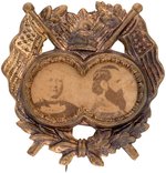 GREELEY & BROWN ORNATE 'LIBERTY CAP' BRASS SHELL JUGATE BADGE.