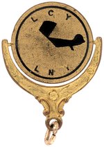 CHARLES LINDBERGH "LUCKY LINDY" BLACK ENAMEL ON BRASS SPINNER PICTURING HIS AIRPLANE.