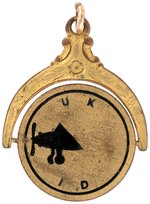 CHARLES LINDBERGH "LUCKY LINDY" BLACK ENAMEL ON BRASS SPINNER PICTURING HIS AIRPLANE.