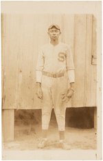 C. 1920s-1930s AFRICAN AMERICAN BASEBALL PLAYER REAL PHOTO POSTCARD.