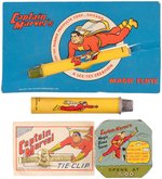 "CAPTAIN MARVEL MAGIC DIME SAVER" BANK, TIE BAR ON CARD & FLUTE PAIR.