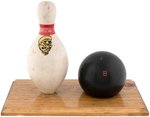 WORLD WAR II ANTI-AXIS DUCK PIN AND BOWLING BALL DISPLAY.