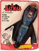 "THE FLYING CATWOMAN" CARDED FOREIGN GLIDER TOY.