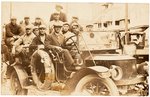 C. 1910s UNIDENTIFIED BASEBALL TEAM IN EARLY AUTOMOBILE REAL PHOTO POSTCARD.