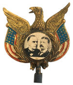 McKINLEY AND ROOSEVELT JUGATE WHISTLING EAGLE UNLISTED MECHANICAL BADGE.