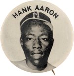 C. 1950s HANK AARON (HOF) PM10 REAL PHOTO STADIUM BUTTON.