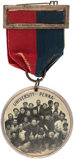 "UNIV. OF PENNA." FOOTBALL TEAM ON 1894 RIBBON BADGE WITH TWO-SIDED CELLULOID SUSPENSION.