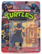 "TEENAGE MUTANT NINJA TURTLES - SHREDDER" SERIES 1 44 BACK CARDED ACTION FIGURE.