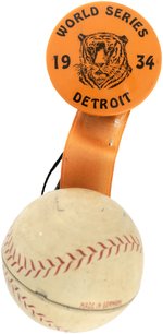 1934 DETROIT TIGERS "WORLD SERIES" BUTTON W/RIBBONS AND TIN BASEBALL.