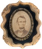 ABRAHAM LINCOLN C. 1865 ALBUMEN PORTRAIT MOURNING BROOCH.