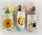 PEZ DISPENSERS IN ORIGINAL CELLO LOT OF THREE (COCKATOO AND RAVEN PAIR).