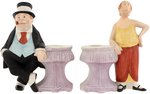 BRINGING UP FATHER - MAGGIE & JIGGS FIGURAL BISQUE CANDLESTICK PAIR.